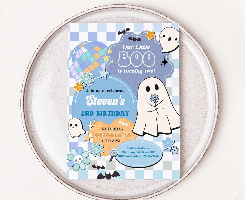 a white plate with a blue and white birthday card on it