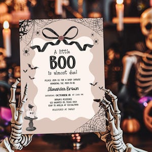 a halloween party with skeleton holding up a sign