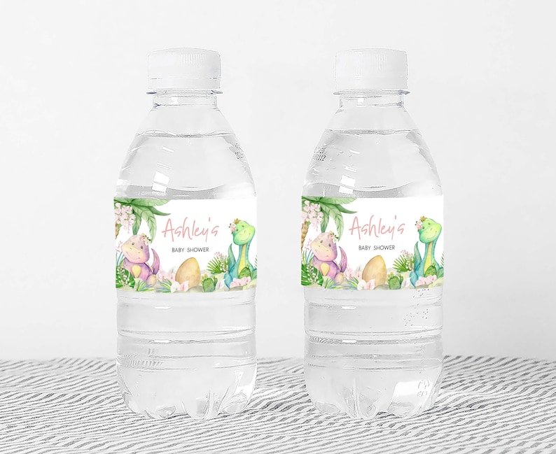 two water bottles with labels on them sitting on a table