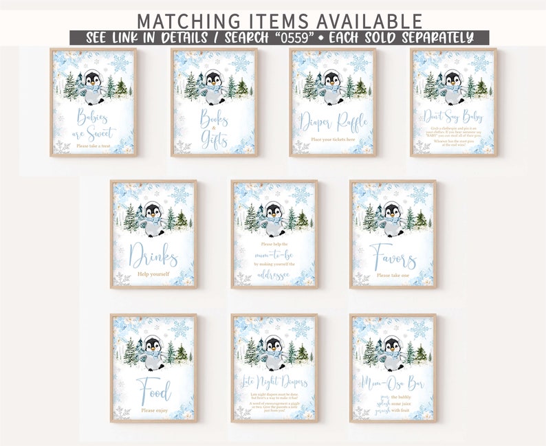 May include: A collection of framed signs with a winter penguin theme. Each sign features a watercolor illustration of a penguin in a scarf, surrounded by snowflakes and trees. Text on the signs includes "Babies are Sweet," "Books & Gifts," and "Diaper Raffle."