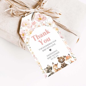 a gift wrapped in brown paper with a tag on it