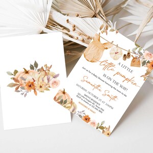 a wedding card with a floral design on it