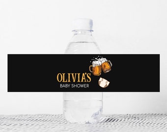 May include: A black and white baby shower water bottle label with the text "Olivia's Baby Shower" and a cartoon image of two beer mugs clinking.
