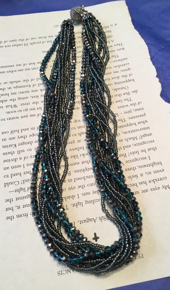 Multi strand iridescent blue beaded necklace