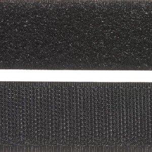 May include: Two strips of black hook and loop fastener tape. The top strip has a fuzzy texture, while the bottom strip has a woven texture.