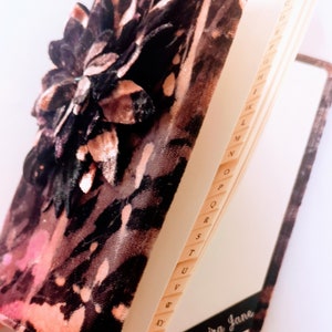 Address book in purple,pink,red Sumptious handpainted velvet, a3D dahlia flower with leather leaves on its cover.size 13cmx18cmx1.5.