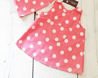 Summer chasuble dress in pink cotton with white polka dots, with pocket in front, 6 months, 1 year, 2 years, 4 years