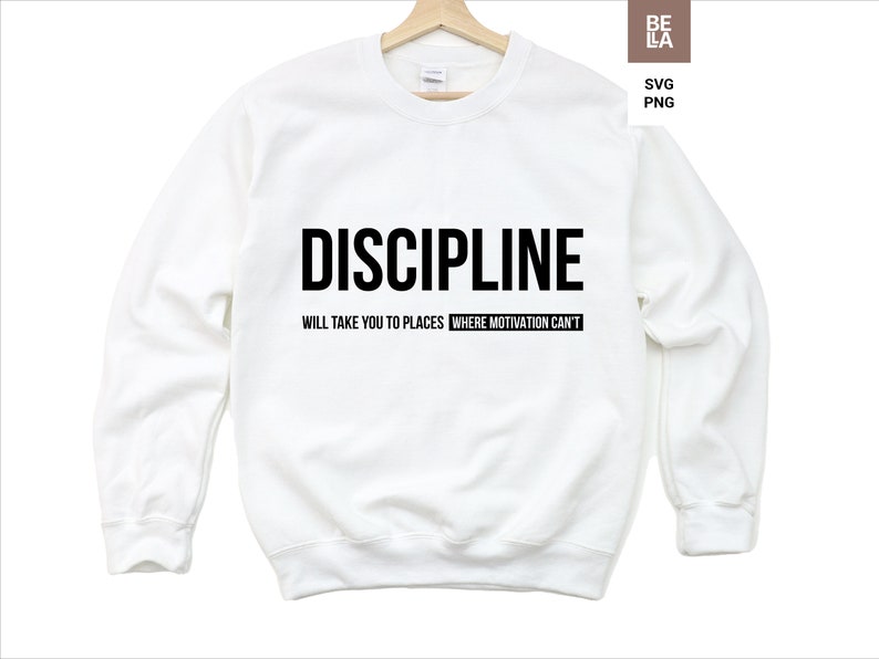 May include: White sweatshirt with black text that reads "DISCIPLINE WILL TAKE YOU TO PLACES WHERE MOTIVATION CAN'T."