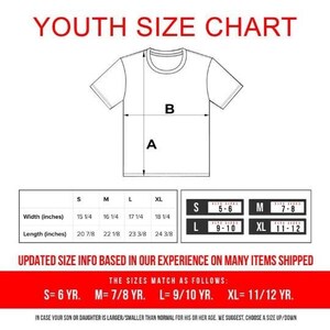 May include: White t-shirt size chart with measurements in inches. The chart includes width and length for sizes S, M, L, and XL. Text at the top reads "YOUTH SIZE CHART". Additional text provides sizing guidance.