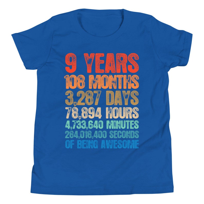 May include: A blue youth t-shirt with a colorful graphic that reads "9 Years 108 Months 3,287 Days 78,894 Hours 4,733,640 Minutes 284,018,400 Seconds of Being Awesome".