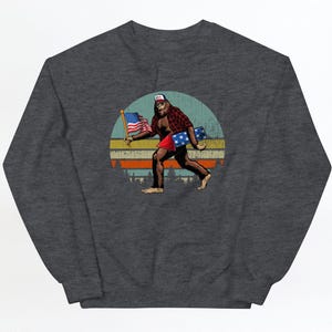 Bigfoot Patriotic Sweatshirt, Bigfoot 4th of July Sweatshirt, Bigfoot Holding American Flag Sweater, Bigfoot USA Lover Gift