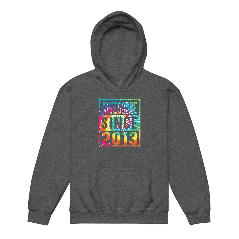 May include: A charcoal grey hoodie with a tie-dye design. The design features the words "AWESOME SINCE 2013" in a colourful, rectangular block.