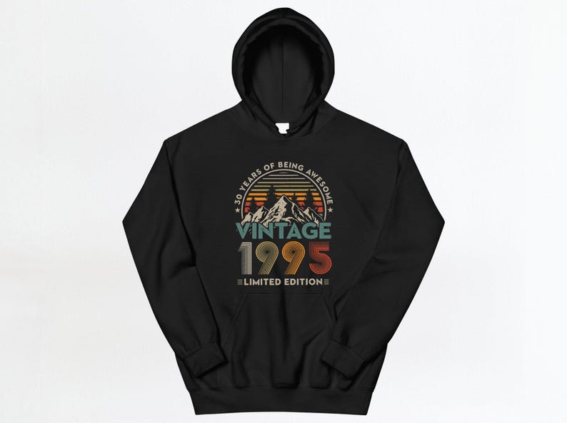 May include: Black hooded sweatshirt with a vintage 1995 design. The graphic features a sunset scene with mountains and the text "30 Years of Being Awesome Vintage 1995 Limited Edition".