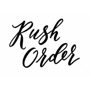 May include: Black calligraphy script on a white background reads "Rush Order." The words are in a flowing, elegant font, with the letters connected. The image is simple and clean.