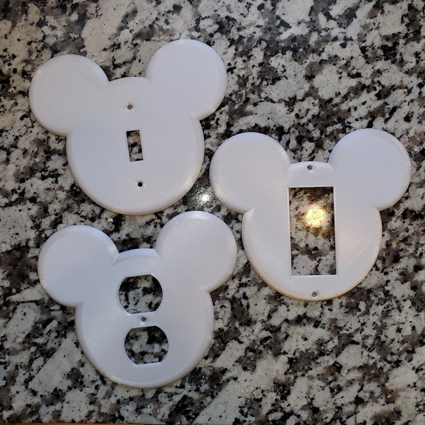 Placa de salida/interruptor de Disney