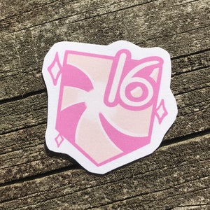 May include: Pink and white sticker with a swirl design and the number 16 in the centre. The sticker has a white border and a diamond shape at each corner.