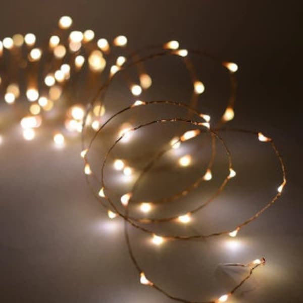 Fairy lights - 10 metre LED solar powered warm white on silver coloured copper wire string lights