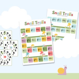May include: Educational music game titled "Snail Trails" with colorful graphics. The game features musical notes, a snail, and the text "Snail Trails by Whole Foundation Method". Includes flashcards with musical notes.