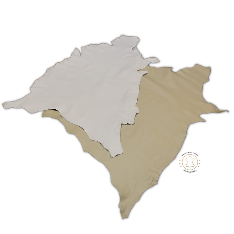May include: Two pieces of leather, one white and one beige, are laid out on a white background. The leather is soft and supple, and it would be ideal for crafting.