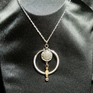 Radiant Sunshine Pendant with Purple and Pink Gems