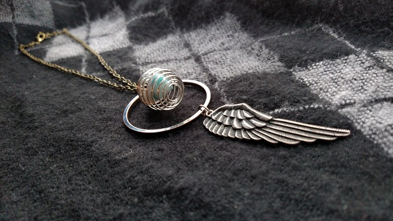Angel Wing Pendant With Beautiful Quantum Quattro Crystal In Spiral Cage
