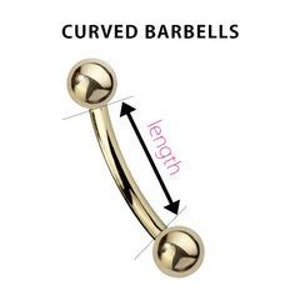 May include: Gold curved barbell with two round balls on each end. The barbell is curved and the length is measured from the center of one ball to the center of the other ball.