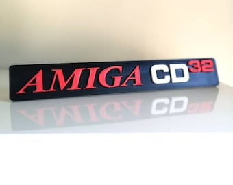 Expositor de estantería/imán para nevera con el logotipo del Amiga CD32