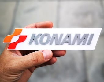 Konami fridge magnet / shelf display - Video Gaming Logo