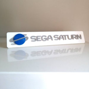 Sega Saturn logo shelf sign/fridge magnet