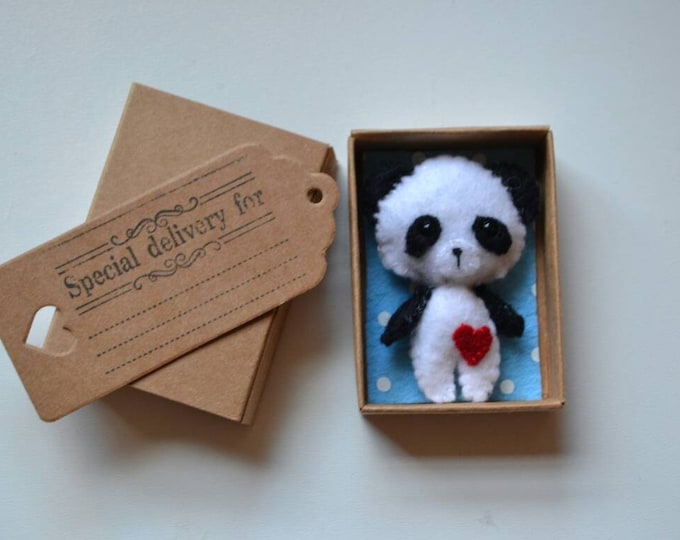 Handmade miniature felt panda in a matchbox