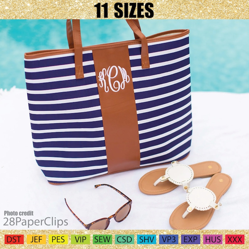 May include: A navy blue and white striped tote bag with brown leather handles and a brown leather panel with a white monogram. Sunglasses and sandals are next to the bag. The text "11 SIZES" is at the top.
