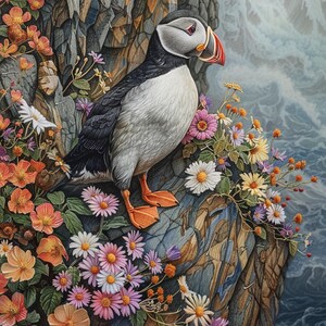 May include: A colorful illustration of an Atlantic puffin perched on a rocky cliffside, surrounded by vibrant wildflowers. The bird has a white breast, black back, and a distinctive orange beak and feet. The background shows a seascape with waves.