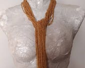 sciarpa collana di fili di perline color rame arancio