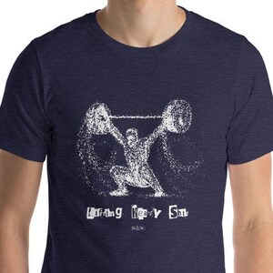 May include: A navy blue t-shirt with a white graphic of a person lifting weights. The text "Lifting Heavy Stuff" is printed below the graphic.