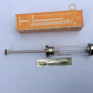 seringue en verre vintage, médicament vintage, bizarreries médicales, outils de médecin, cadeau de pharmacien, thème médical, seringue en métal, seringue ancienne