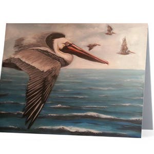 Scheda di nota di Brown Pelican volare sopra l'oceano