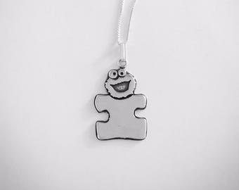 PLAY! Cookie Monster Puzzle Symbol Necklace.