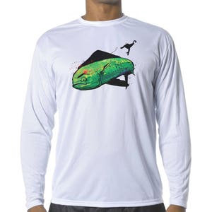 May include: White long-sleeve shirt with a colorful graphic of a mahi-mahi fish being reeled in. The fish is green, blue, and yellow with red spots.