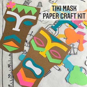 May include: A paper craft kit for making tiki masks. The kit includes two brown cardboard mask shapes, colorful paper cutouts, and instructions. The text "TIKI MASK PAPER CRAFT KIT" is printed on the white background.