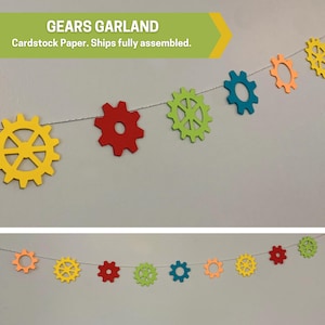 May include: A colorful paper gear garland with red, yellow, green, blue, and orange gears. The garland is strung together with white string. The text "Gears Garland" and "Cardstock Paper. Ships fully assembled." is visible at the top of the image.