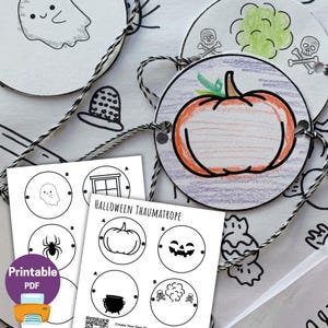 May include: A collection of Halloween-themed thaumatropes, featuring hand-drawn illustrations of a pumpkin, ghost, spider, and skull and crossbones. The printable PDF includes instructions for creating the optical illusion toy. The thaumatropes are connected by black and white twine.