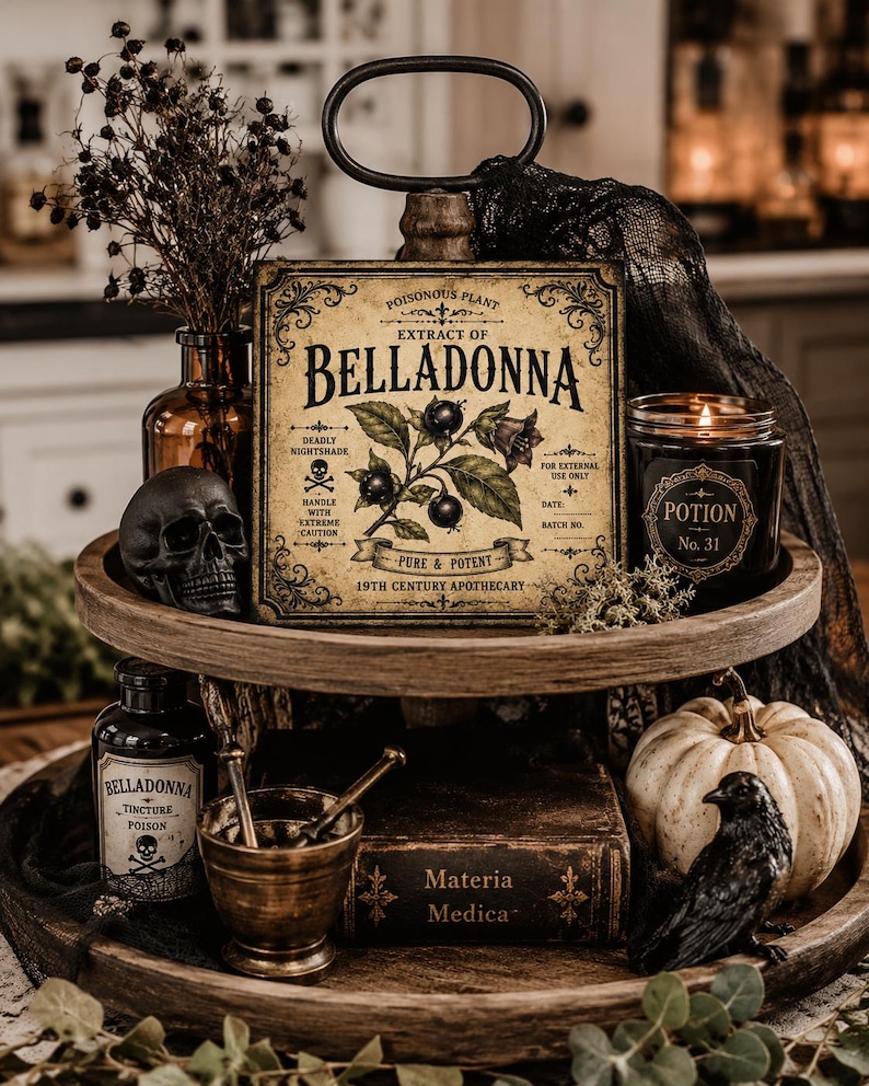 May include: A two-tiered wooden tray holding a square sign labeled Extract of Belladonna, a black skull, a Potion No. 31 candle, a Belladonna Tincture bottle, a brass mortar and pestle, a Materia Medica book, a white pumpkin, and a black raven figure.