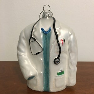 Doctor White Lab Coat ornament with stethoscope. Christmas Ornament. 41/2 inches tall. Fragile. For that Special Dr. in your life.
