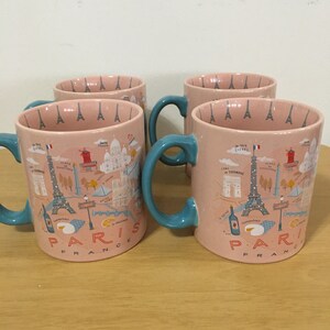 Four Extra Large Paris Eiffel Tower Mugs. 4 1/2 inches tall. Lovely.