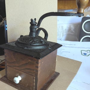 Vintage reproduction of an antique coffee mill grinder cast iron and wood
