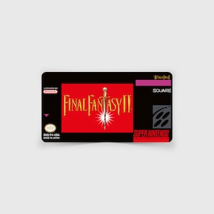 May include: A black and red Super Nintendo game cartridge with the title "FINAL FANTASY II" in gold lettering. The game is licensed by Nintendo and made in Japan. The cartridge is labeled "SNS-F4-USA".