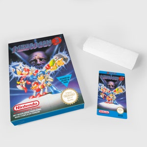 May include: A blue and white Nintendo game cartridge box for Mega Man 3. The box features a cartoon image of Mega Man and other characters from the game. The text "Mega Man 3" is printed in large, white letters on the front of the box. The box also includes a small, gold seal that says "Original Nintendo Seal of Quality".