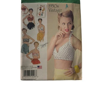 May include: Simplicity sewing pattern 1426 D5, featuring a vintage 1950s design. The pattern includes illustrations of various bra and top styles. The package is green and white, with the text "1950s Vintage" and "Simplicity".