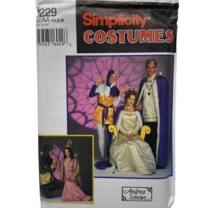 May include: A Simplicity Costumes pattern packet featuring illustrations of medieval costumes. The packet includes images of a queen, a king, and other characters in various outfits. The packet is white with the Simplicity Costumes logo in red.