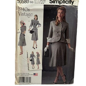 May include: Vintage Simplicity sewing pattern from the 1940s. The pattern features a woman in a gray suit with a double-breasted jacket and a pencil skirt. The pattern also includes illustrations of other vintage outfits. The pattern size is U.S. 20W-28W.